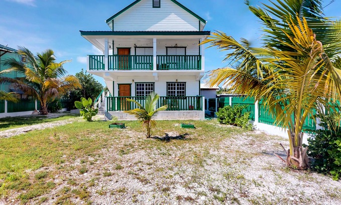 Caye Caulker Cottage | Entire duplex with patio, balcony, partial AC & WiFi - next to a Caribbean beach