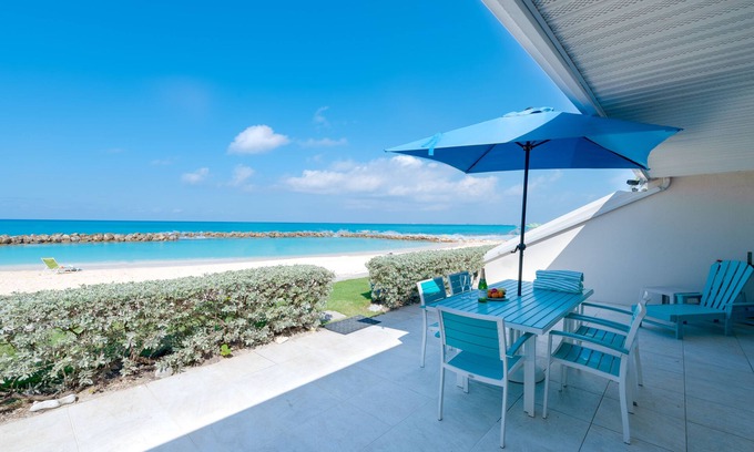 Seven Mile Beach Condo | Experience the turquoise blue waters up close & personal from this unit!