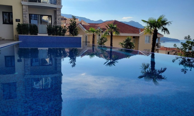 Becici Apartment | Family-friendly 2-Bedroom Sea View Apartment with Huge Terrace, Pools, Spa & Gym