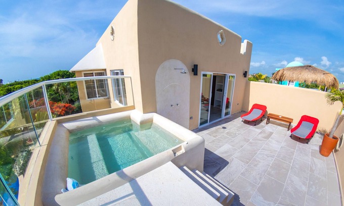 Akumal Condo | Family getaway in this charming townhouse just steps away from Yal Ku Laggon!