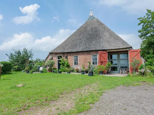 Burum Apartment | Farmhouse by Lauwers River with Rowing Boat