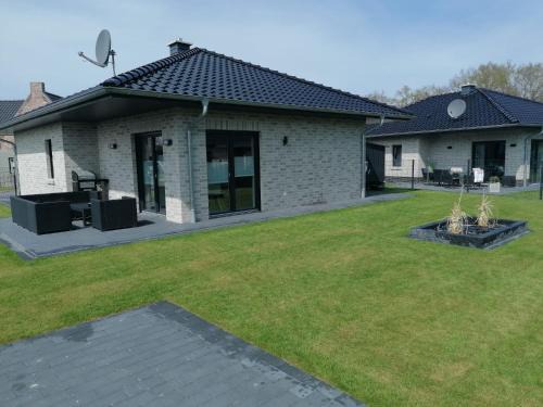 Barssel House | Ferienhaus Devilina mit Sauna am Harkebrügger See