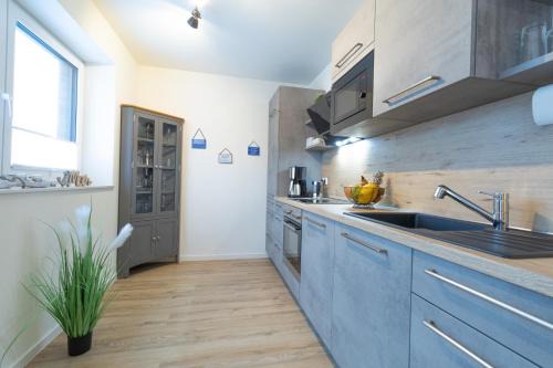 Dorumer Neufeld Apartment | FeWo Seebrise mit Sauna und Balkon