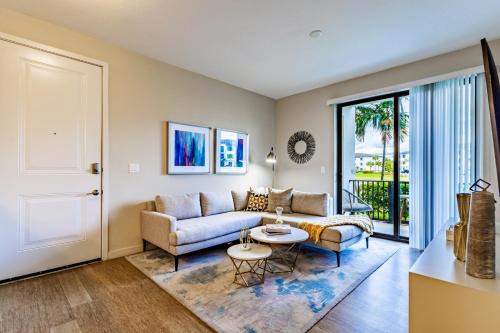 Three Oaks Apartment | Fort Myers 2BR Condo Pool BBQ Area