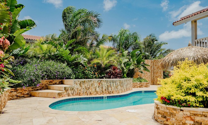 Bubali Apartment | Gorgeous modern 1-bedroom apartment with tropical garden, pool and whirlpool