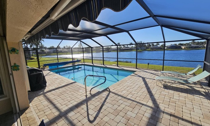 Beachwalk Isles House | Gorgeous sunsets over the lake with heated pool! Close to beaches and golf