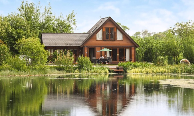 Menai Bridge Ski Chalet | Ground floor: Spacious open plan lounge, kitchen, dining area with log burner.