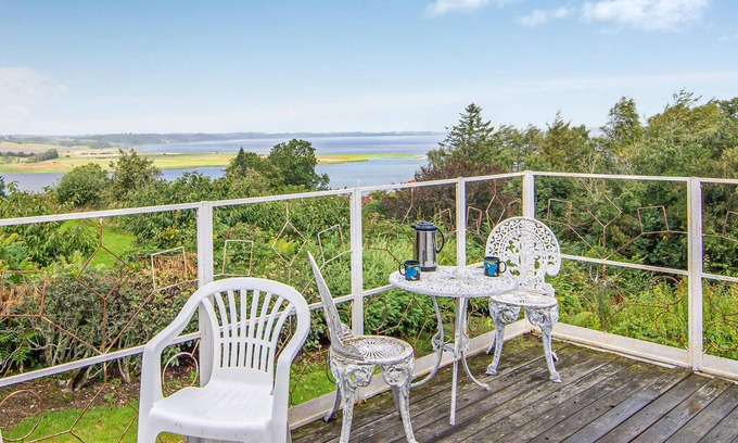 Hjarbæk House | High up, with a fantastic view of the fjord, is this beautiful cottage that provides the setting for