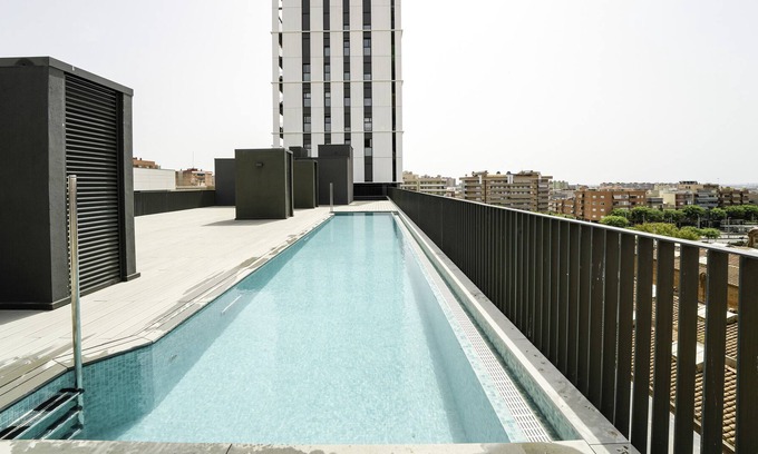 Cornella de Llobregat Apartment | Holiday Apartment "Sunsets and The Pool In Barcelona" with Balcony, Shared Pool & Wi-Fi