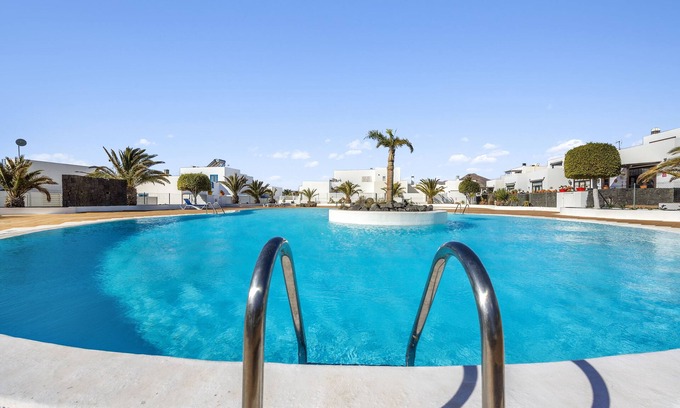 Puerto Calero House | Holiday home at the harbour of Puerto Calero with roof terrace, garden and pool