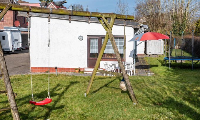 Wesselburen House | Holiday Home 'Haus Lahrsen' with Private Terrace, Shared Garden and Wi-Fi