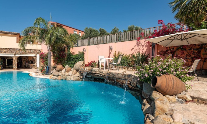 Province of Cagliari House | Holiday Home Sa Domixedda with Shared Garden, Shared Pool & Wi-Fi