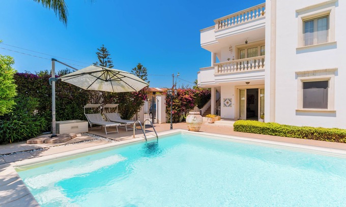 Santa Maria al Bagno House | Holiday Home 'Sofia' with Shared Pool, Balcony and Air Conditioning