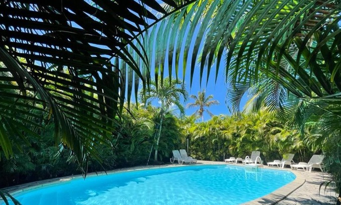 Sainte-Rose House | Homerez - House for 4 ppl. with shared pool, sea view and garden at Sainte-Rose