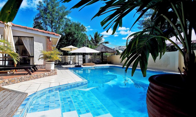 Glacis House | Homerez - Spacious House with Shared Pool in Machabee