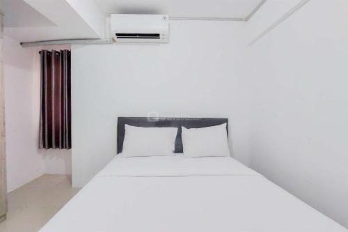 South Tangerang Apartment | Homey and Comfort Living 2BR Urbantown Serpong Apartment By Travelio