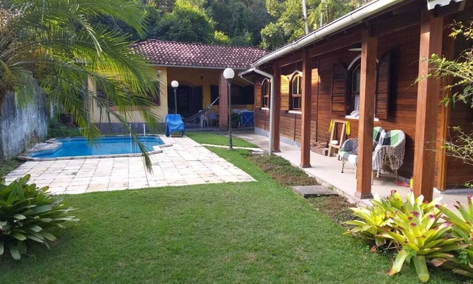 Prumirim House | House, 8 people, 5 bedrooms, 4 bathrooms. Open cond, concierge, 24-hour rounds.