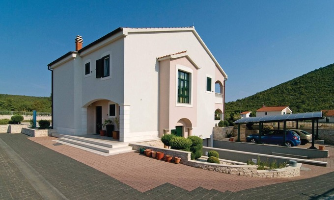 Seget House | In a small quiet place in a large garden is located this cottage with nicely furnished interiors.