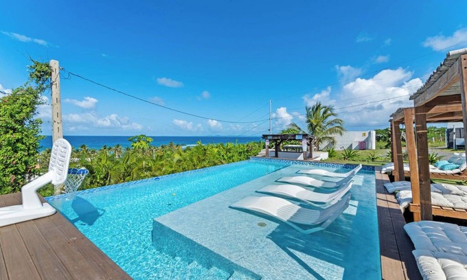 Villa Borinquen House | INFINITY POOL - Ocean View & walk 5 min to beach , 5BR + 3Baths. & Playground!