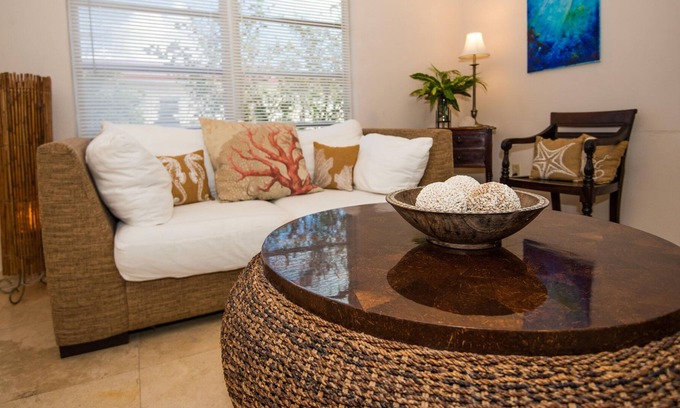 Cockburn Town Apartment | Island House: Modern suites w/ pool, tropical gardens & incredible water views