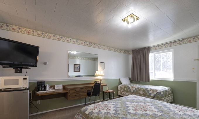 Frontier House | KABINO: Fossil Butte Motel #11 King A/C Mini Fridge Microwave Cable Wifi