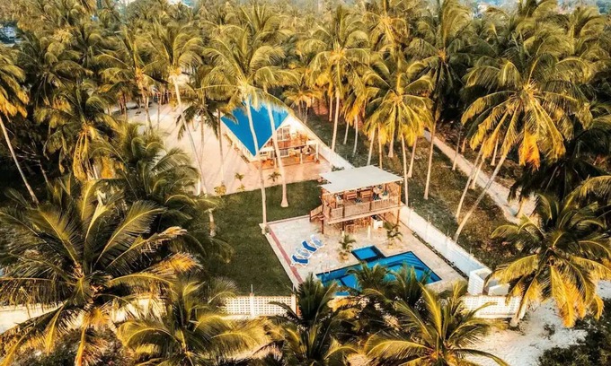 Upanga East Villa | Karibu Beach Villa - A private beach front home with a large pool and gardennn