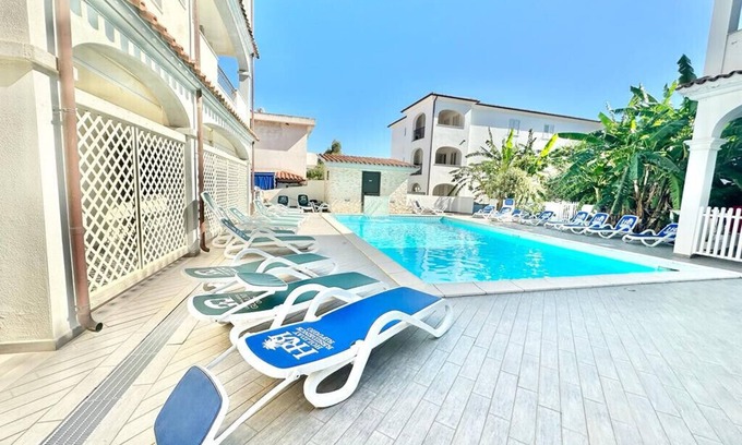 Orosei Apartment | [Kumquat]Apartment in Orosei with a pool view.