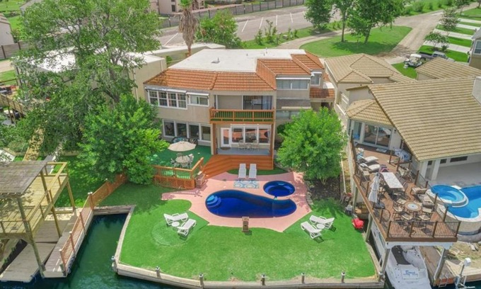 April Sound House | Lake front retreat with pool, spa, golf, fishing, boat slip, 4 bed, 4 bath sleeps 21