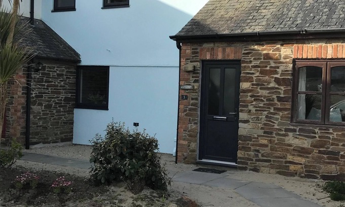 Porthtowan House | Located 60m from beach and situated opposite the sand dunes. Loved by families.