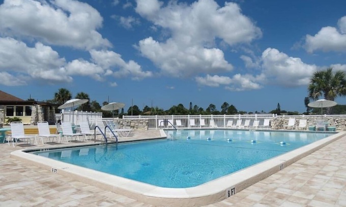 Gardens of Gulf Cove House | Located in an active community w/heated pools, tennis courts and shuffleboard