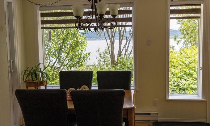 Chateau-Richer Apartment | Lodging Petit Séjour water view. Families and pets welcome!