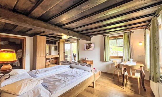 Ramsau am Dachstein Villa | Lovely apartment in villa for 2 guests with WIFI, TV, balcony, pets allowed and parking