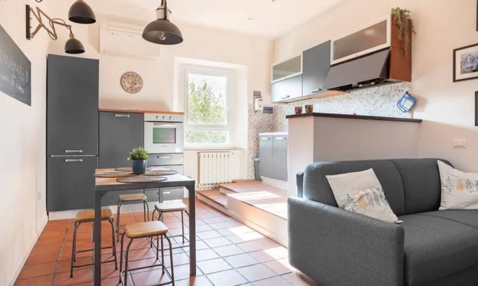 Ancona Condo | Lovely apartment with fireplace station area