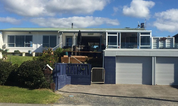 Waihi Beach House | Lovely sunny home with beach views to the front and county views at the back.