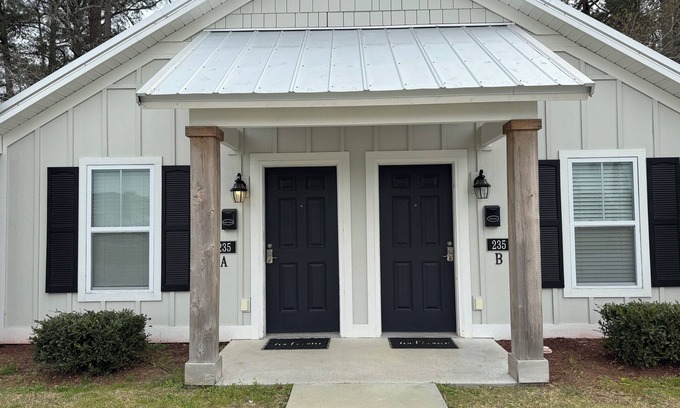 Elizabethtown Resort | Luxury Lodging, Lakefront View, King Bed w/Private Bath, Private Patio.