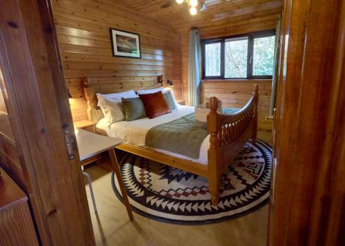 Dolgellau Ski Chalet | Luxury Wood Lodge with sauna, log burner & private woodland garden - Wnion Wood Lodge