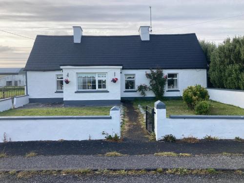 Quilty House | Maisie's Seaside Cottage