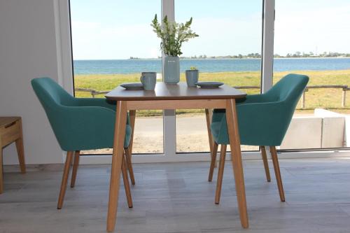Fehmarnsund Apartment | Meerblick Fehmarnsund 1 - direkt am Strand
