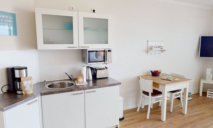 Pelzerhaken Apartment | Modern 1-room vacation apartment for 2 people and dog with balcony and sea view