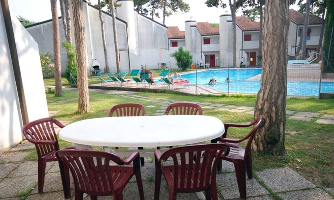 Lignano Sabbiadoro Apartment | Modern and fully equipped four room apartment with pool