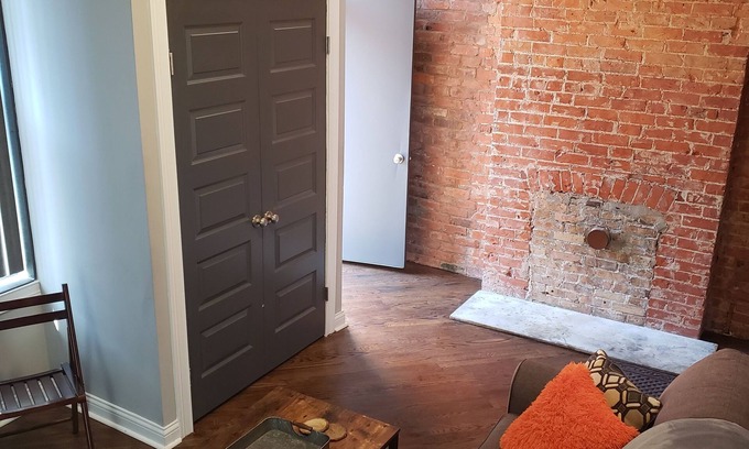 Corryville Apartment | Modern rustic split-level with private balcony