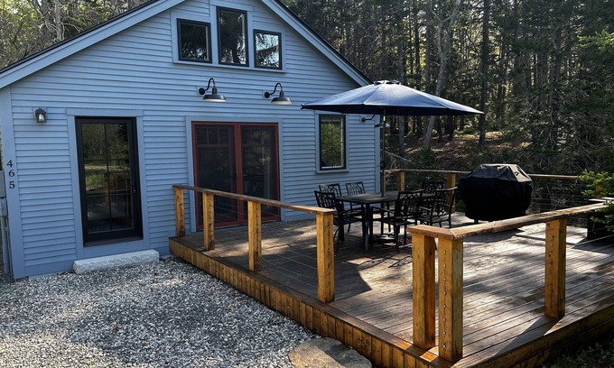 Isle of Springs Cottage | Modern woodland privacy with ocean, trails, and lobster all in walking distance.