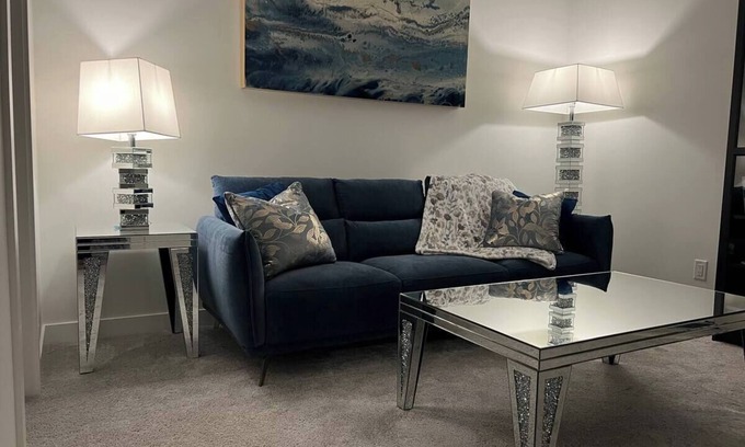 Southeast Calgary Condo | New, stylish suite. Private entrance, queen bed, full kitchen, in-suite laundry.