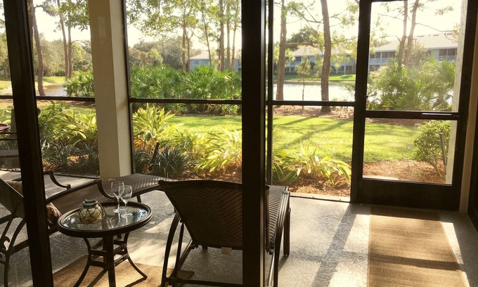 Bonita Bay Condo | Newly Renovated Corner Unit. Lake Views. Shuttle to Beach. Heated Pool/Spa