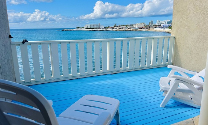 Maho Apartment | Nice and cozy ocean front studio with private terrace. Short walk to beaches.