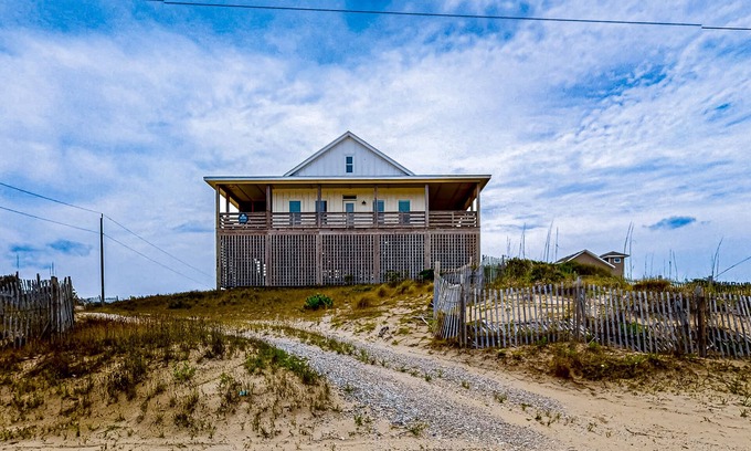 Carova Beach House | Ocean-view home with wrap-around deck, beach access, outdoor shower & cornhole
