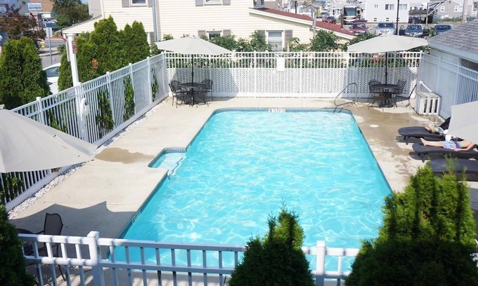 Hampton Apartment | Ocean view with a shared pool. 5