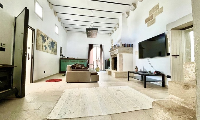 Lequile House | Old renovated millstone with jacuzzi