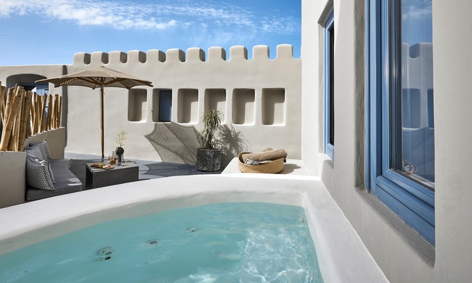 Pyrgos Apartment | Outdoor hot tub, Caldera and sunset views