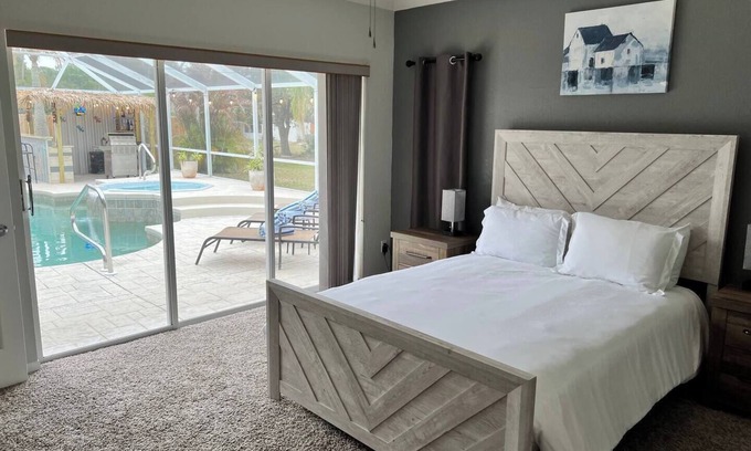 Laurel House | Peachland getaway with pool and tiki bar.